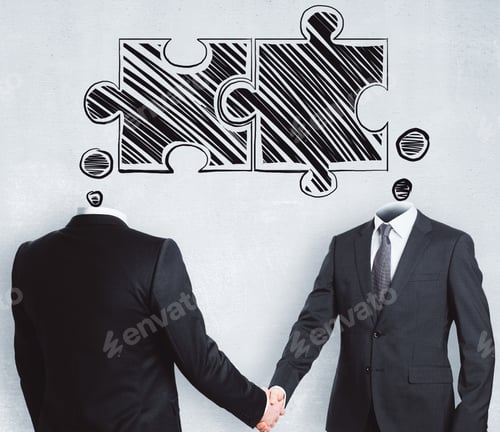 Preview: Puzzle Headed Businessmen Shaking Hands On Concrete Background. Teamwork And Success Concept