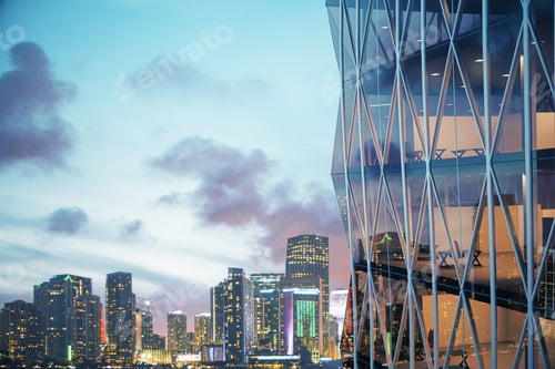 Preview: Modern Vitreous Skyscraper With Night City At Background 3D Render