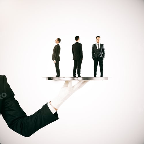 Preview: Hand Holding Silver Tray With Three Tiny Businessmen On Light Background. Hr Concept