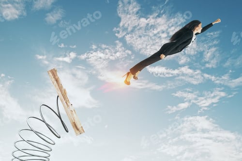 Preview: Businesswoman Lauching Off Big Spring On Sky Background With Clouds. Startup And Success Concept