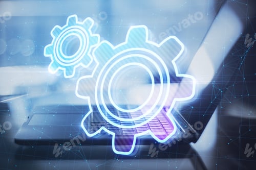 Preview: Close Up Of Laptop At Desktop With Abstract Glowing Gear Wheels On Blurry Background With