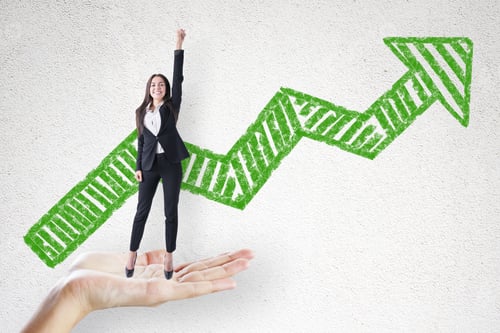 Preview: Abstract Hand Holding Happy Businesswoman With Green Arrow Sketch On Concrete Wall Background