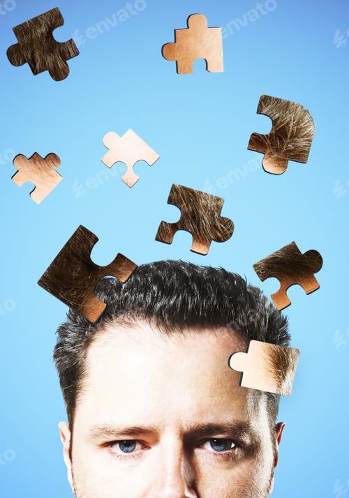 Preview: Puzzle Headed Businessman On Blue Background. Confusion And Pensive Concept