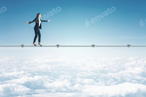 Preview: Businemwoan Walking On Rope On A Blue Sky Background. Business And Challenge Concept.