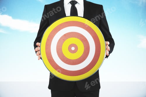 Preview: Man Holding A Target For Darts