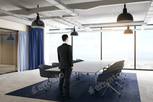 Preview: Side View Of Thoughtful Young Businessman Standing In Modern Conference Room Interior With