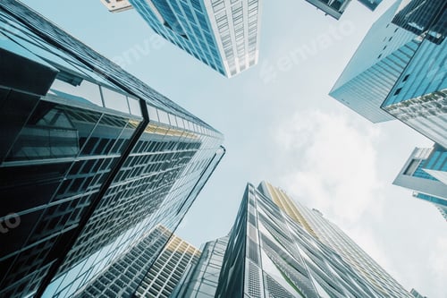 Preview: Bottom View Of Skyscrapers On Bright Blue Sky Background. Urban And Lifestyle Concept