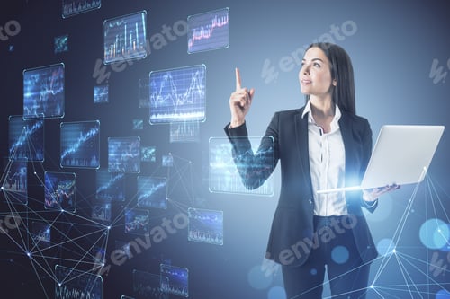 Preview: Attractive Young European Businesswoman Using Laptop With Creative Forex Charts On Blurry