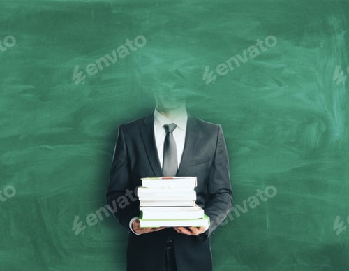Preview: Headless Businessman With Books On Chalkboard Background. Education Concept
