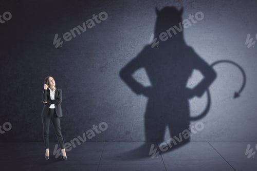 Preview: Attractive Thoughtful Young European Businesswoman With Devil Shadow Standing In Empty Concrete