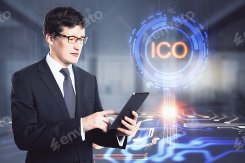 Preview: Attractive Young European Businessman Using Tablet With Glowing Ico Hologram On Blurry Office