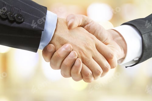 Preview: Human Handshake On A Blured Yellow Background