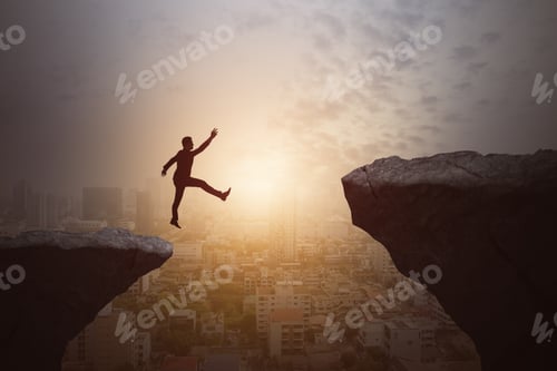 Preview: Businessman Jumping From Cliff On Beautiful Sky And City Background. Gap, Leap, Risk, Challenge And