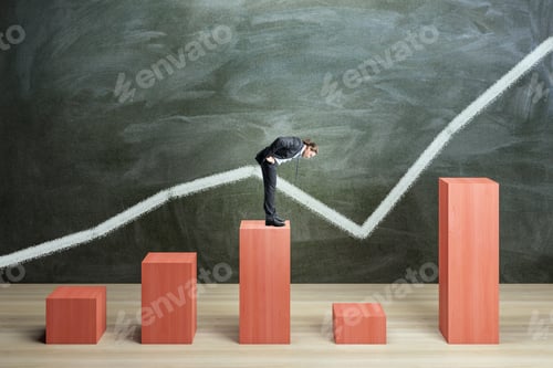 Preview: Businessman On Red Chart Bars On Chalkboard Wall Background. Crisis, Business And Growth Concept