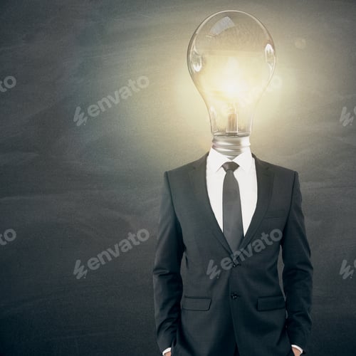 Preview: Glowing Lamp Headed Businessman On Chalkboard Background. Idea Concept
