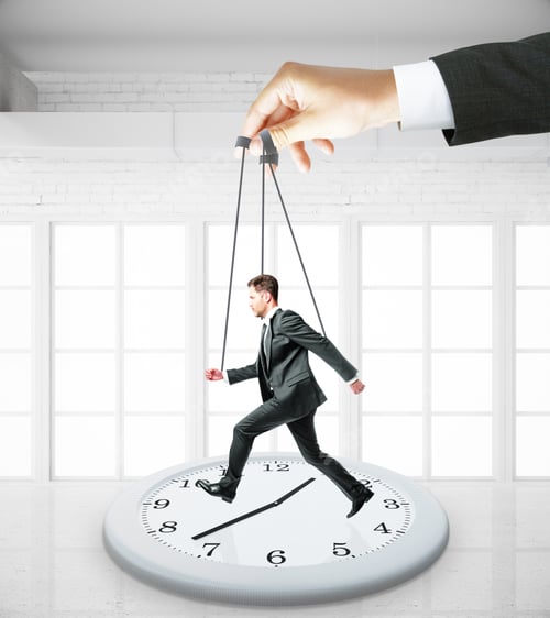 Preview: Huge Hand Making Businessman Run On Abstract Clock. White Interior Background. Manipulation And