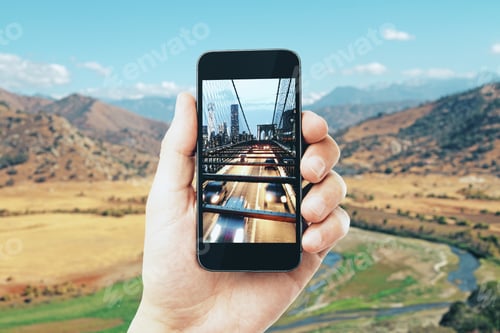 Preview: Hand Taking Photo Of City With Smartphone. Creative Background Concept