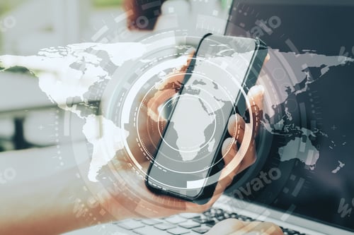 Preview: Close Up Of Hands Using Laptop And Smartphone With Creative Map Hologram On Blurry Background