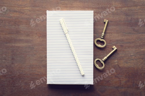 Preview: Diary With Pen And Keys On A Wooden Table