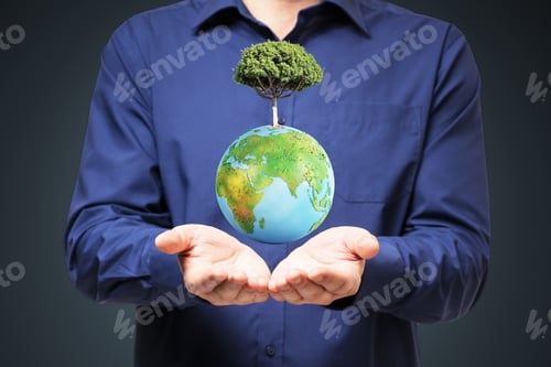 Preview: Close Up Of Businessman Hands Holding Abstract Globe With Tree On Dark Background. World, Earth