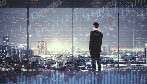 Preview: Back View Of Young Businessman In Modern Office With Night City View And Candlestick Forex Chart