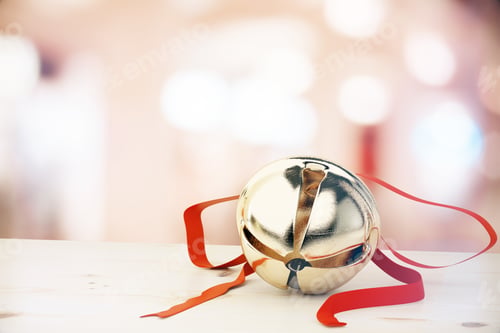 Preview: Jingle Bell With Red Ribbon On White Table