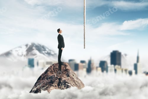 Preview: Side View Of Young Businessman Standing On Mountain Top And Looking At Rope On Abstract Blurry Sky