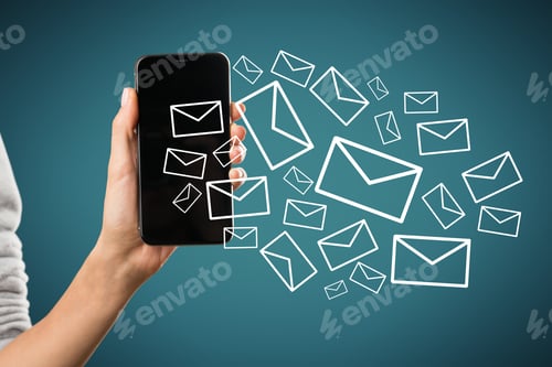 Preview: Close Up Of Female Hand Holding Smartphone With Creative Drawn Email Icons On Blue Background