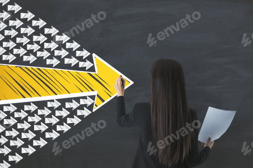 Preview: Businesswoman With Document In Hand Drawing Group Arrows On Blackboard. Leadership And Challenge