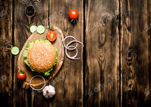 Preview: Cooked Burger With Vegetables, Cheese And Meat. On Wooden Background. Top View.