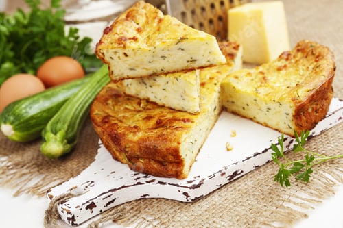 Preview: Pie With Zucchini, Cheese And Herbs On The Table
