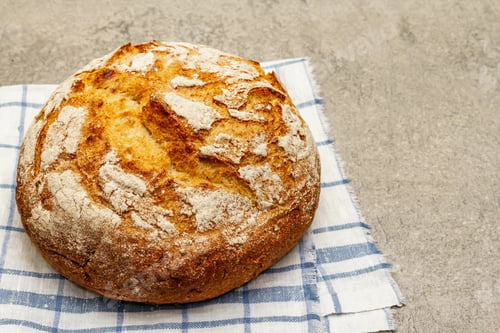 Preview: Fresh Baked Bread On Vintage Linen Napkin. Grey Stone Concrete Background, Copy Space