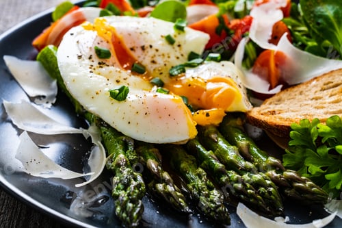 Preview: Boiled Egg With Bread, Asparagus, Parmesan And Vegetable Salad On Wooden Table