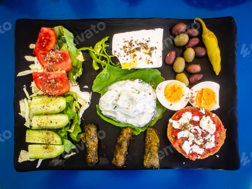 Preview: Crete Plate - Fresh Greek Salad, Feta Cheese, Dolmades, Tomatoes, Lettuce, Boiled Egg, Black And