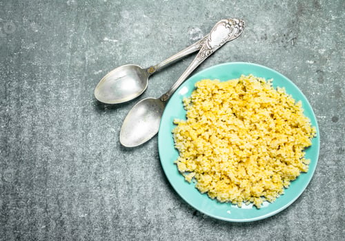 Preview: Millet Porridge With Butter. On Rustic Background.