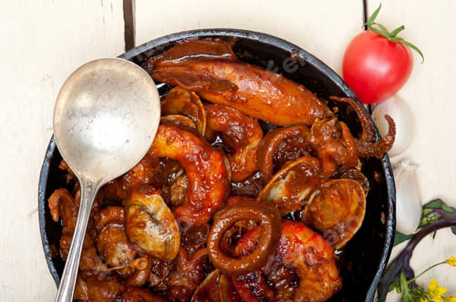 Preview: Fresh Seafood Stew Prepared On An Iron Skillet Ove White Rustic Wood Table