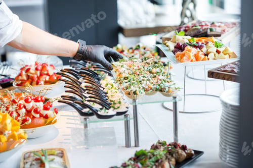 Preview: The Waiter Makes The Organization Of Snacks On The Table, Before The Arrival Of The Guests