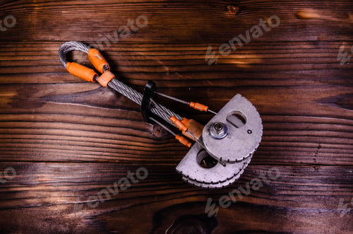 Preview: Camming Device Friend For Rock Climbing On Rustic Wooden Table. Top View