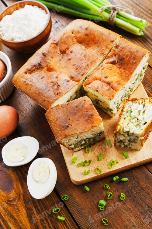 Preview: Pie With Spring Onion And Eggs On The Table