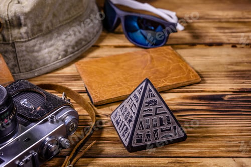 Preview: Hipster Hat, Vintage Camera, Sunglasses, Souvenir Pyramid And Passport On Wooden Background. Travel