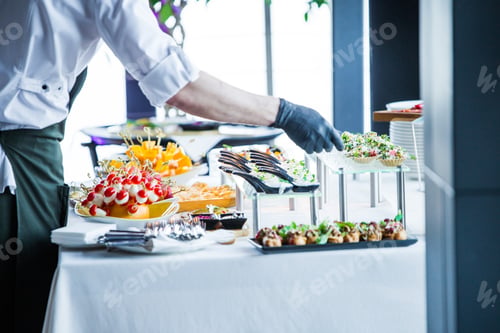 Preview: The Waiter Makes The Organization Of Snacks On The Table, Before The Arrival Of The Guests