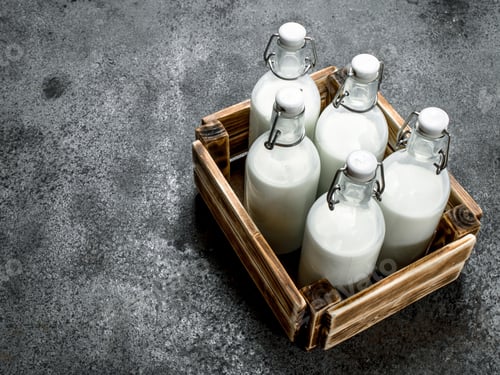 Preview: Bottles Of Fresh Milk In An Old Box. On A Rustic Background.