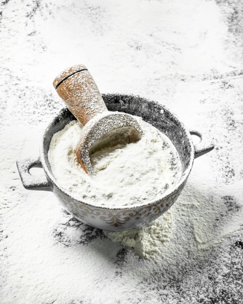 Preview: Flour With A Scoop In A Bowl. On The Stone Table.