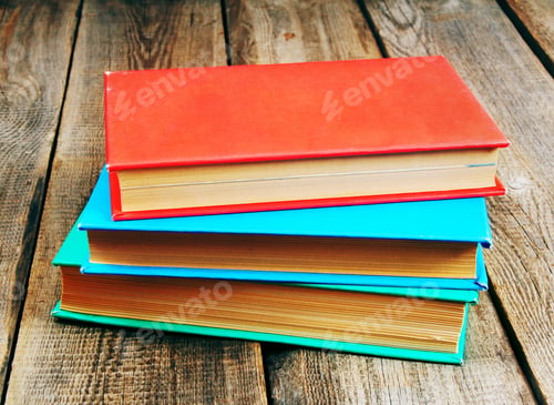 Preview: Books. On A Wooden Background.