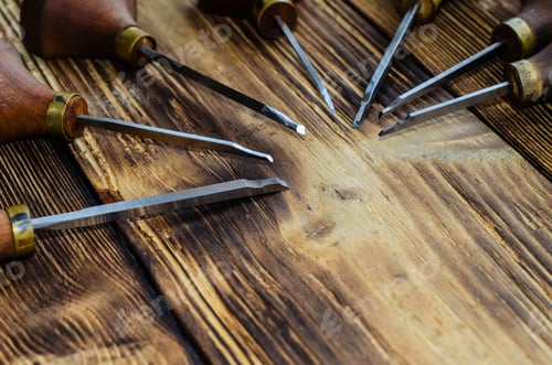 Preview: Different Gravers For Jewelry On A Wooden Background