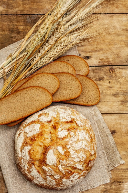 Preview: Fresh Baked Bread With Wheat Ears And Slices. Vintage Wooden Boards Table, Kneading The Dough, Top