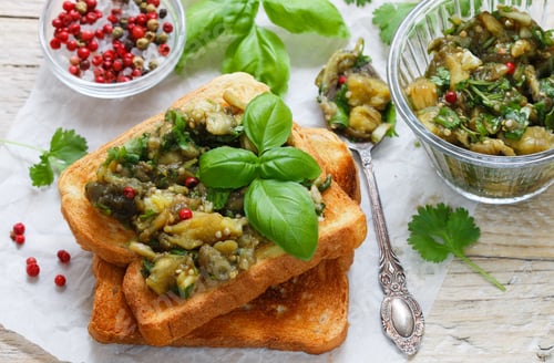 Preview: Baked Eggplant On Bread Croutons With Garlic, Cilantro And Basil. Spicy Snack. Selective Focus