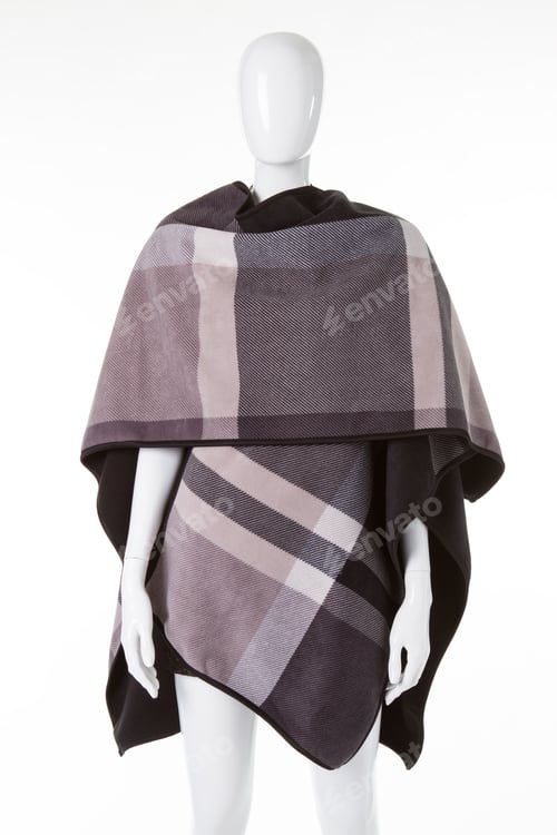 Preview: Checkered Poncho On Female Mannequin. Dark Garment With Pattern. Comfortable Wear For Women. Brand