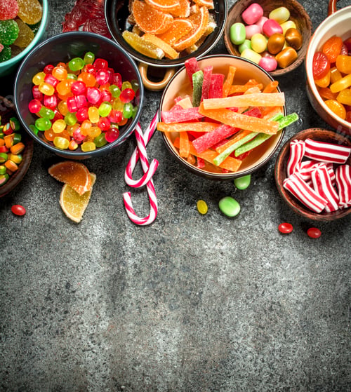 Preview: Multicolored Candy, Jelly And Marshmallows In A Bowl. On A Rustic Background.