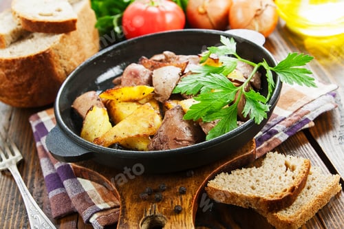 Preview: Potatoes Stewed With Chicken Liver On The Table